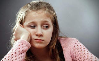 A girl experiencing tween moodiness