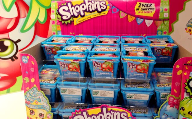 Shopkins miniature shopping baskets on a shelf in the store.