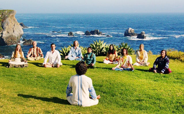Don Draper, in Mad Men's final episode, facing a group of people who are all meditating next to a c...