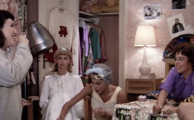 The main female characters from 'Grease' at a slumber party