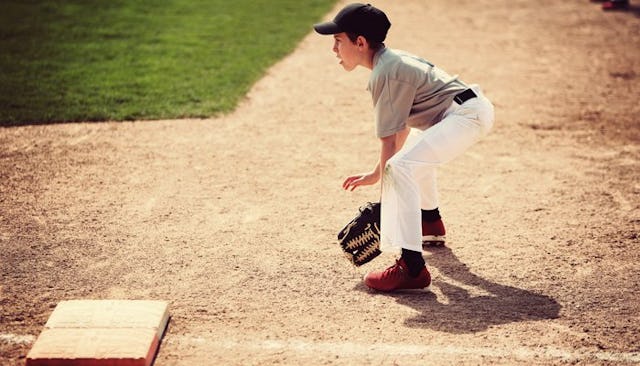 A little boy playing baseball