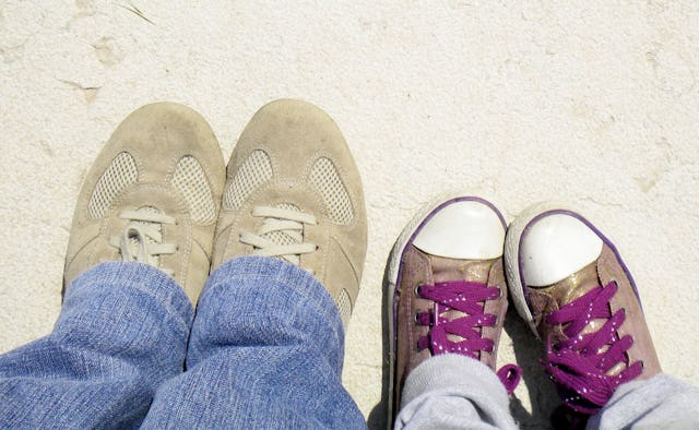 A daughter's shoes next to her ex-boyfriend's shoes next to each other