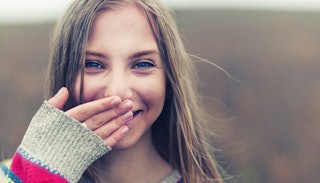 A teenage daughter smiling 