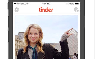 Screenshot of a Tinder account with a woman touching the tip of the Louvre in Paris on it.