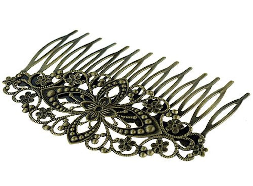 An ornate black hair comb