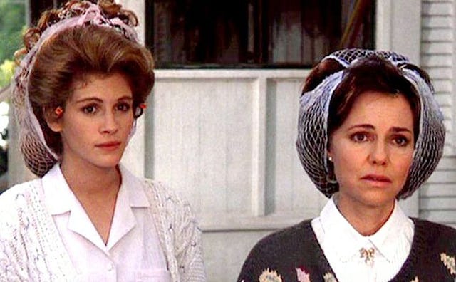 Sally Field and Julia Roberts in Steel Magnolias with curlers in their hair 