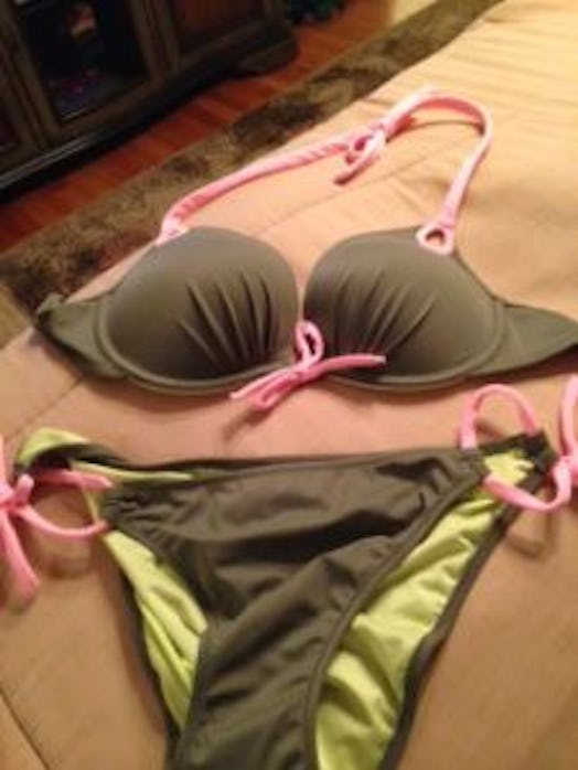 A green and pink bikini a mom can wear on a brown couch in the living room 