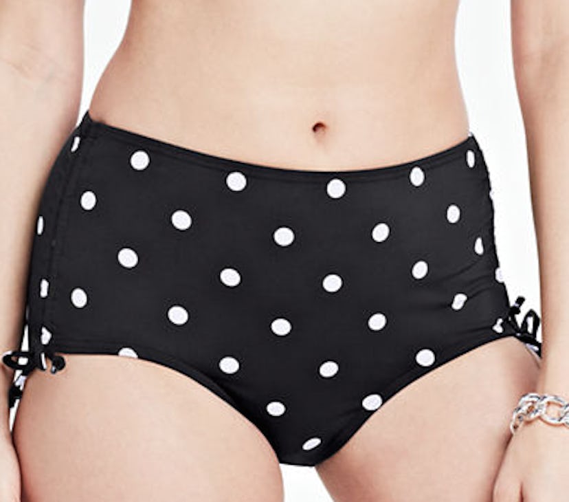 Black swimsuit shorts with white polka dots