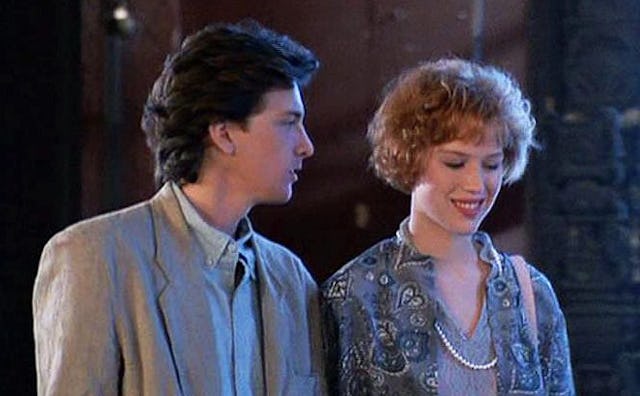 A girl and a boy standing next to each other and the boy is looking at the girl - teens dating in 19...