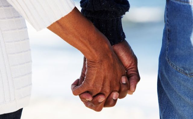 Married couple holding hands