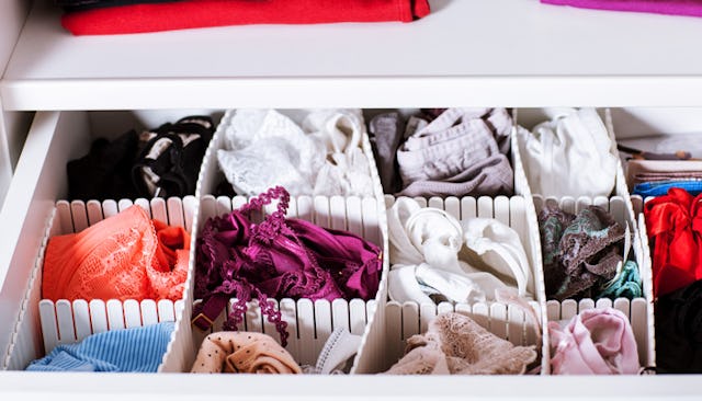 Mom's underwear in different colors, folded inside a drawer organizer
