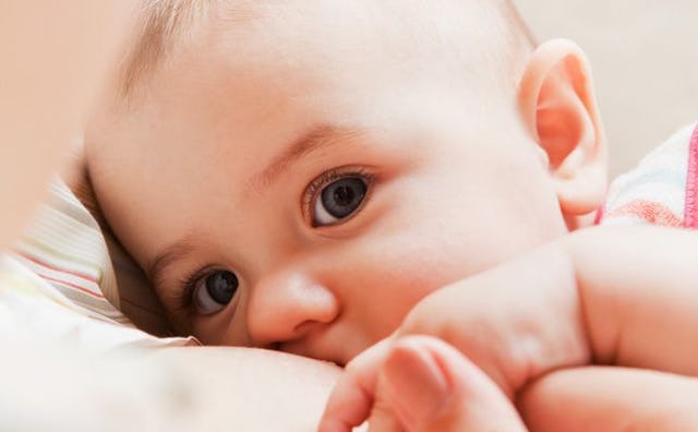 A mother who is new to motherhood breastfeeding her baby