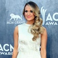Carrie Underwood in a white dress at the ACM Awards