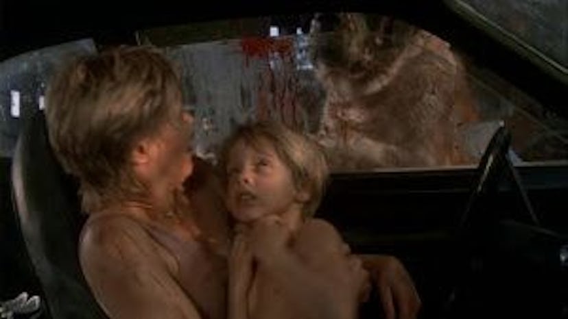 A scene from Cujo where the dog tries to break into a car.
