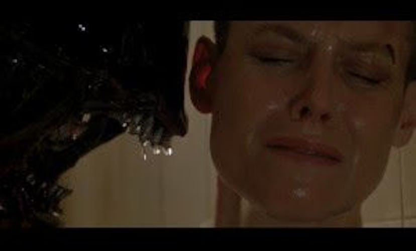 A scene from Alien where the alien is licking Sigourney Weaver’s face.