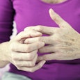  Older woman holding her fingers 