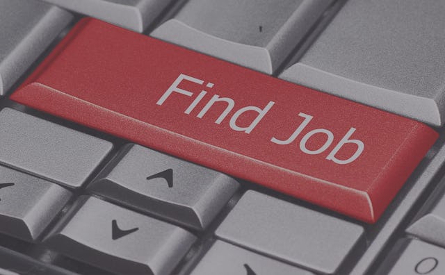 A digital illustration of a PC keyboard with a grey arrow key section and a red 'Find job' button ab...