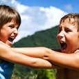 Siblings fighting in the nature