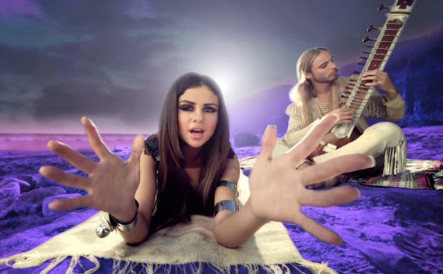 An insert with Selena Gomez and the Scene from 'Love You Like A Love Song' music video with both rid...