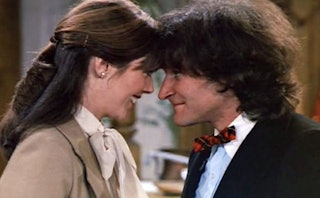 Robin Williams and Pam Dawber as Mork & Mindy from the '70s show, looking at each other.