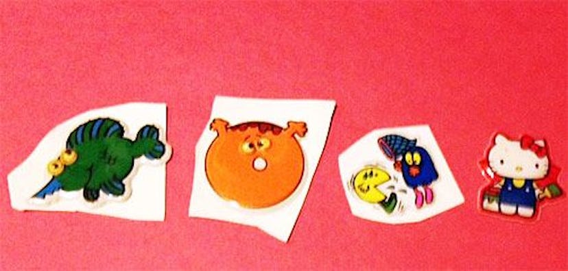 Four separate puffy stickers of different cartoon characters from different collections