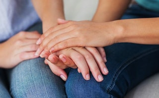 Holding hands and bringing empathy to someone who has lost a child