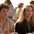 Actors Patrick Dempsey and Amanda Peterson sitting at a table in a scene from the "Can't buy me love...