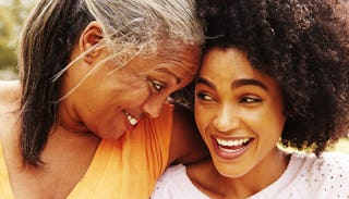 A smiling mom and daughter looking at each other