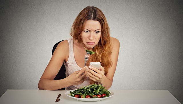 horrified-woman-looking-at-phone