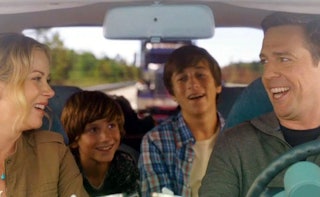 Family from the movie 'Vacation' travelling in a car looking happy.