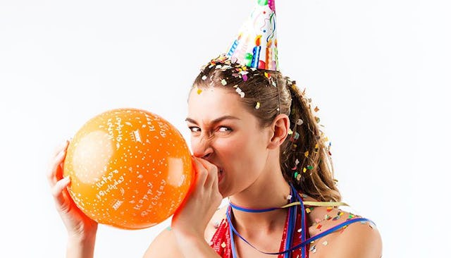 annoyed-woman-inflating-balloon