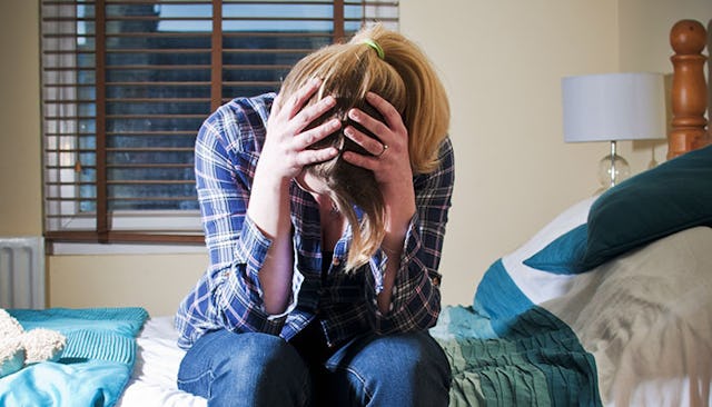 upset-woman-holding-her-head