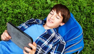 teen-boy-looking-at-ipad