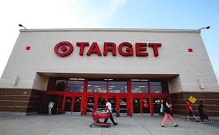 Entrance of the Target shop, people walking in front of it.