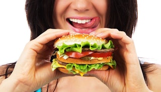 happy-woman-about-to-eat-hamburger