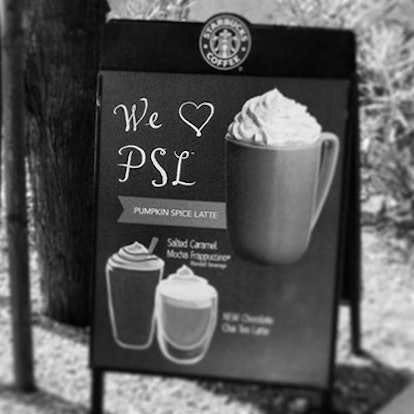 Starbucks sign promoting pumpkin spice latte in black and white