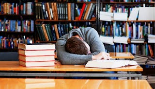 student-sleeping-in-library