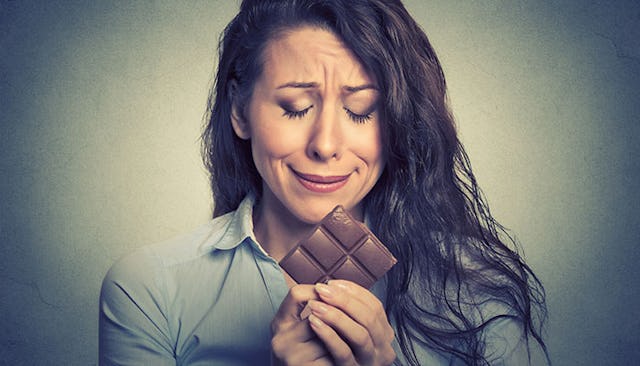 sad-woman-eating-chocolate