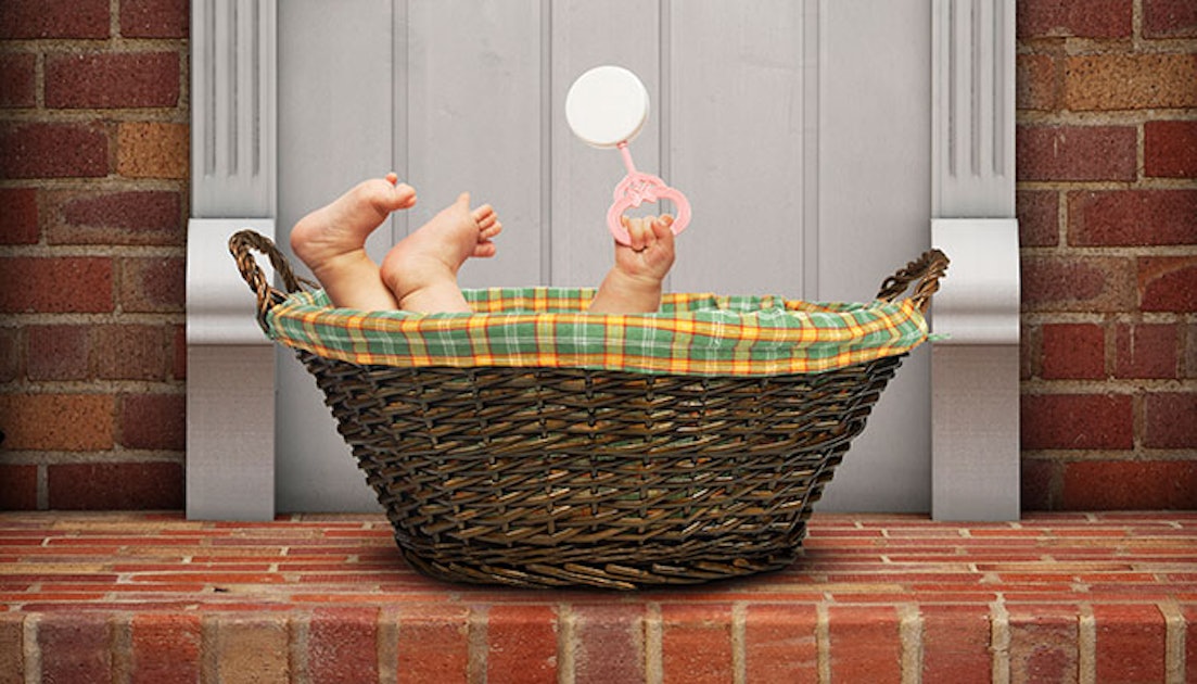 Baby In A Basket On A Doorstep Stock Photo, Picture and Royalty Free Image.  Image 15440807.