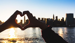 ny-skyline-framed-by-hands-forming-a-heart