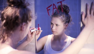 unhappy-teen-labeling-herself-fat