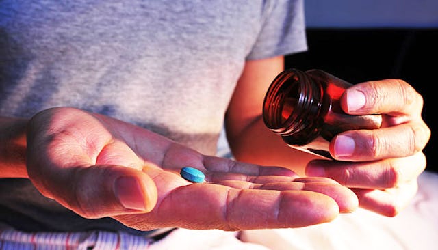 teen-boy-taking-pill