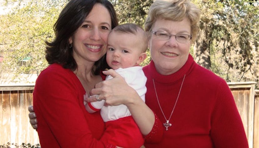 A woman with her daughter-in-law and her grandchild