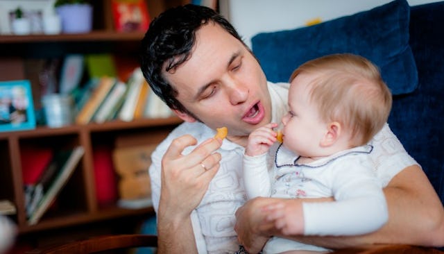 New dad feeding his baby
