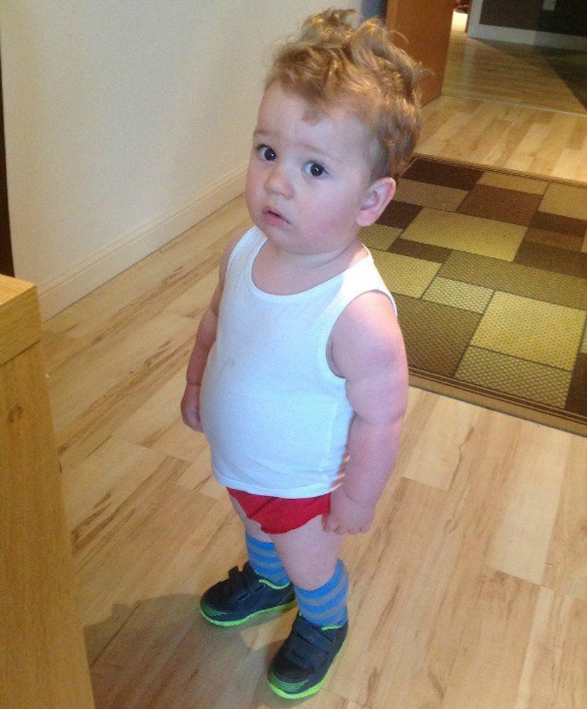 A chubby baby in a Richard Simmons costume