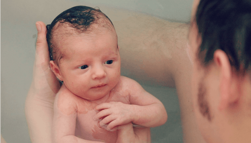 Dad taking a bath with his child