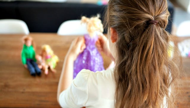 playing with barbies