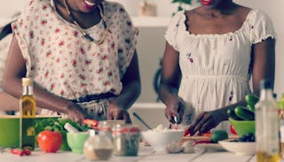 Two sisters cooking in the kitchen 