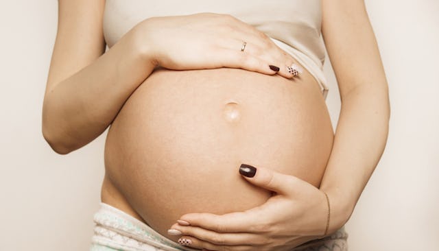 Pregnant woman, pregnant belly, woman touching pregnant belly