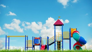 A playground for kids consisted of slide, stairs, shaft, and tower elements in red, blue, green, and...